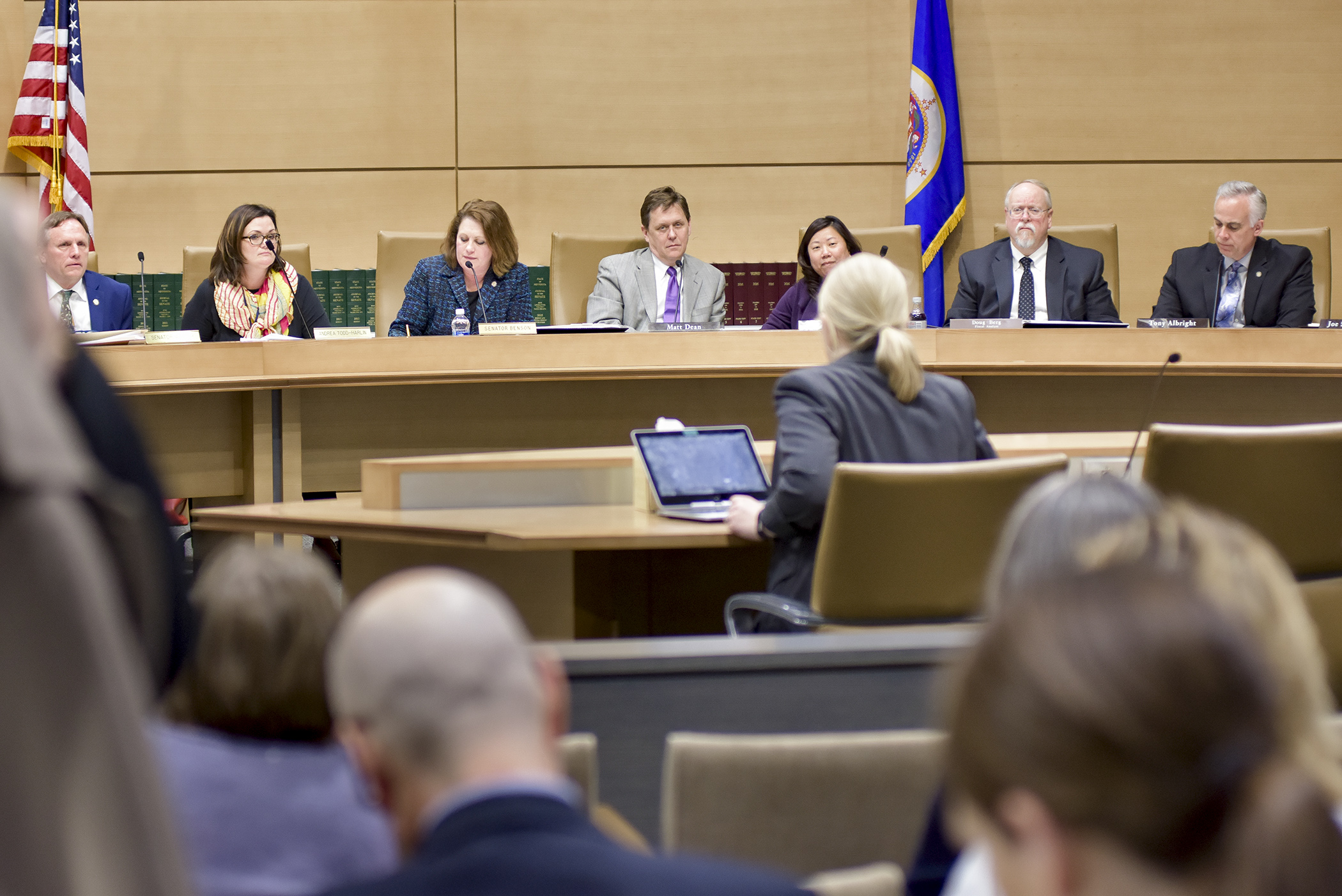 Members of the omnibus health and human services conference committee review policy provisions during their April 25 hearing. Photo by Andrew VonBank